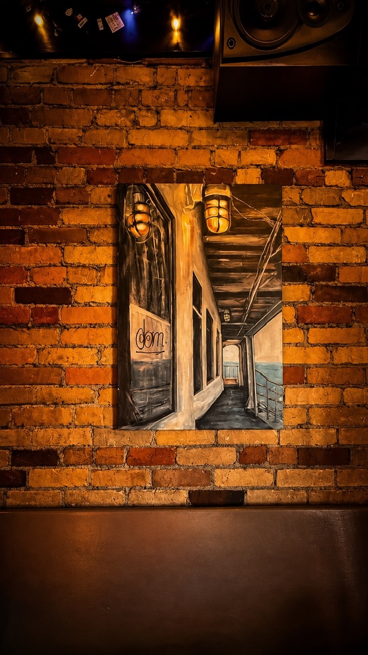 Pour Boy Brick Wall and Artwork